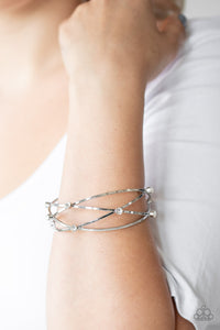 Cosmic Sparkle - White Rhinestone Crisscross Bangle - Paparazzi Accessories