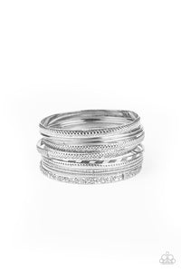 Relics On Repeat - Silver Textured set of 9 Bangle Bracelets - Paparazzi Accessories