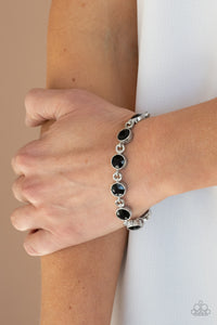 First In Fashion Show - Black Rhinestone Clasp Bracelet - Paparazzi Accessories